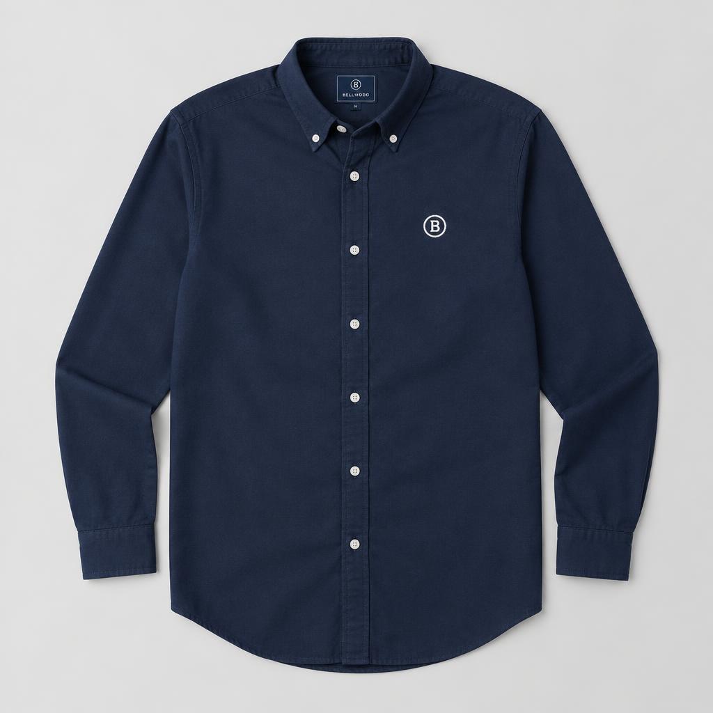 Navy button-up shirt with a white circular B logo embroidered on the chest
